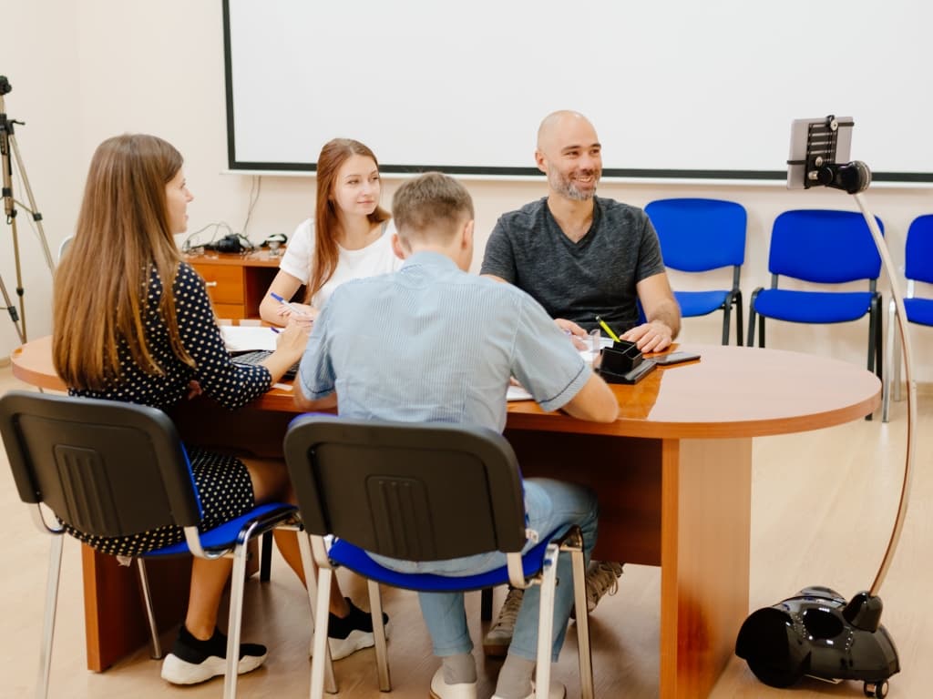 Small company meeting with telepresence robot